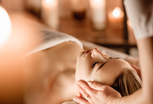 A woman enjoying a massage at the spa