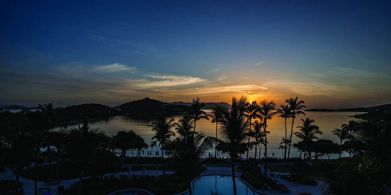 The sun sets as the sparkling pool shines